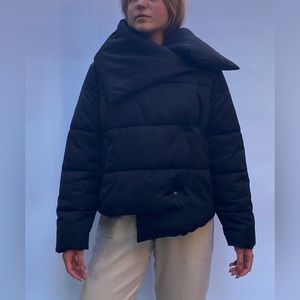 Unique black buffer jacket with square neck details.